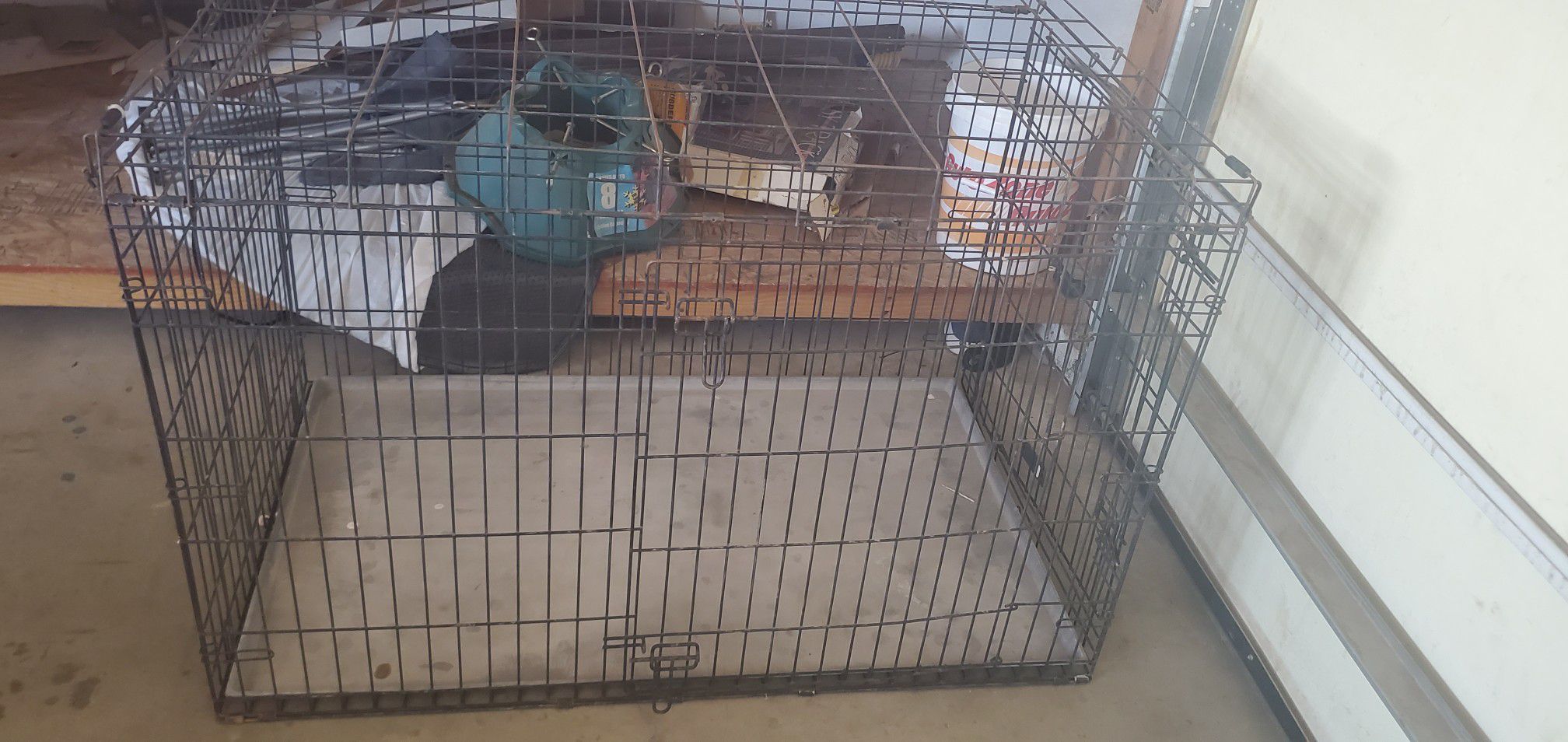 Large dog cage and igloo. $100 for both. OBO Serious buyers only!!