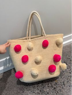 Straw studios tote with pom poms