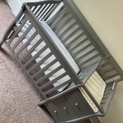  Mini crib with changing table and three drawers