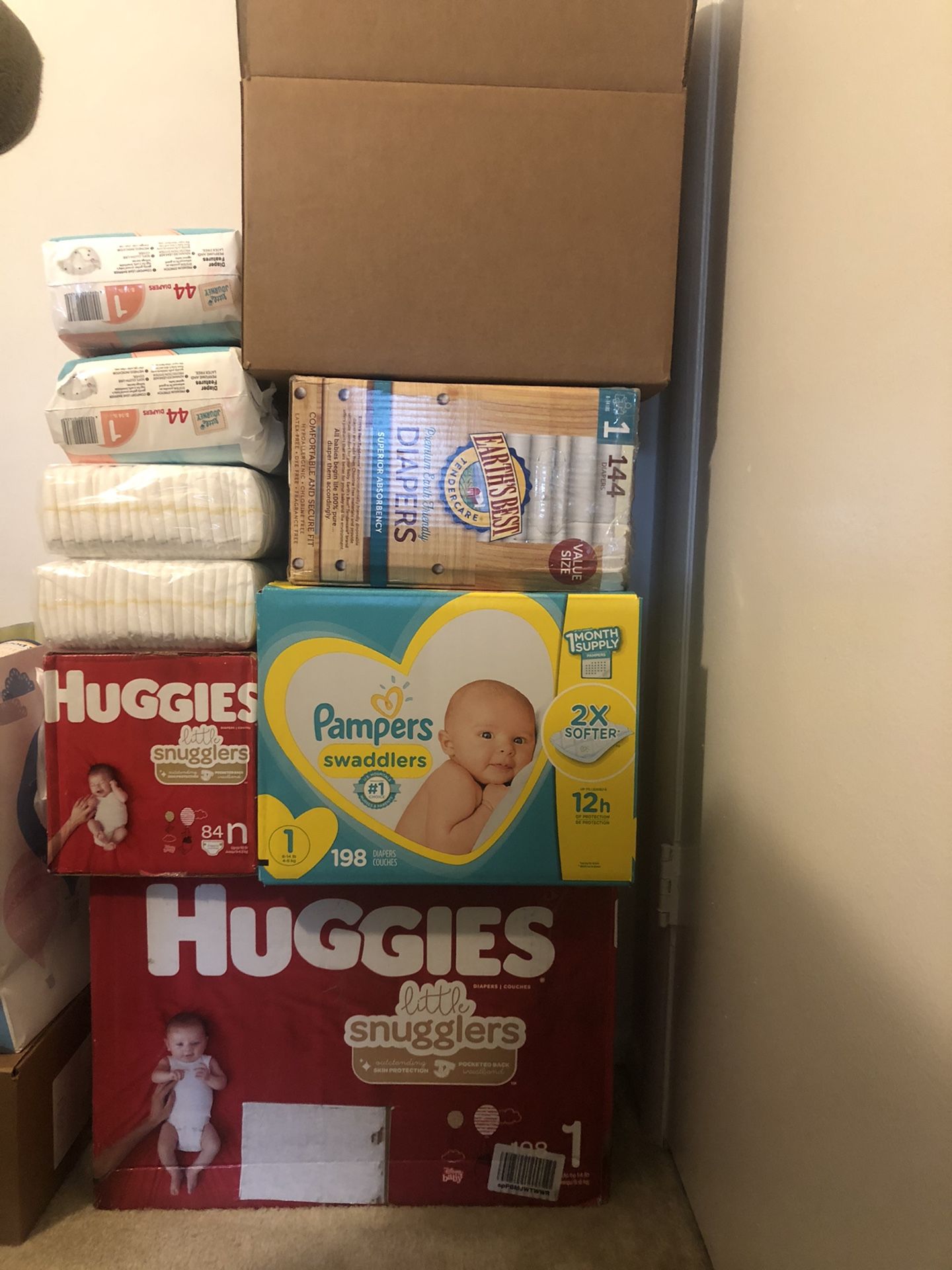 Assorted Diapers, size Newborn and size 1