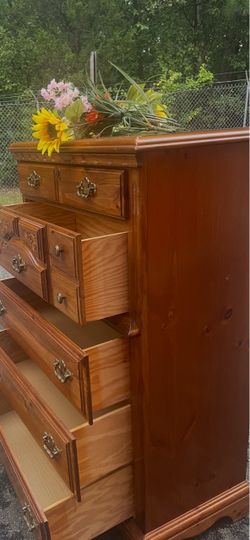 Solid wood tall chest with big drawers . Drawers sliding smoothly. Delivery available