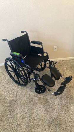 Wheelchair New with Adjustable Elevating Footrests