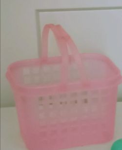 Pink plastic basket with handles