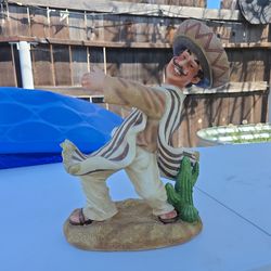 Statue of Man in Sombrero and Poncho