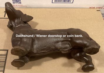 Cast iron dog door stop/ coin bank.