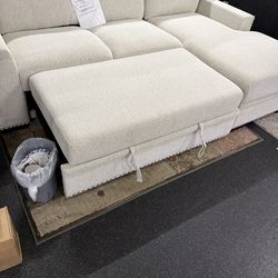 2 Piece sectional with pull out bed and storage chaise on sale