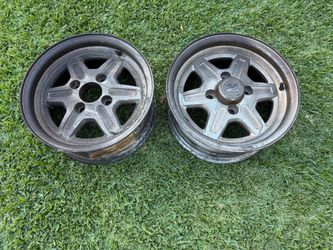 Two Datsun 280Z 14x6 inch aluminum wheels 4 on 114.3 lugs. Nissan