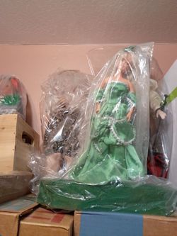 Different types of dolls stand up.