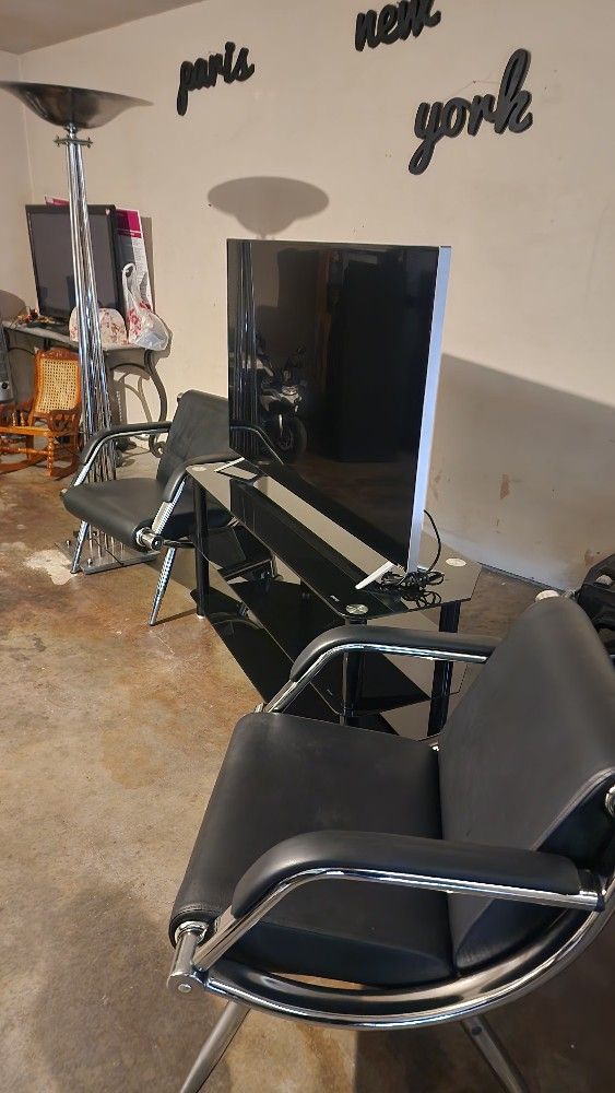 Vizio , Lamp ,tv55" Table Stand And A Black Frame Mirror.