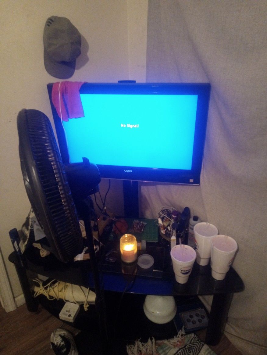 1080p Full HD Vizio TV On TV Stand