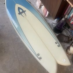 Never used Walden 5’8” tri fin fish surfboard with fins located in South Beach Miami Beach.  The board was used as a display. 