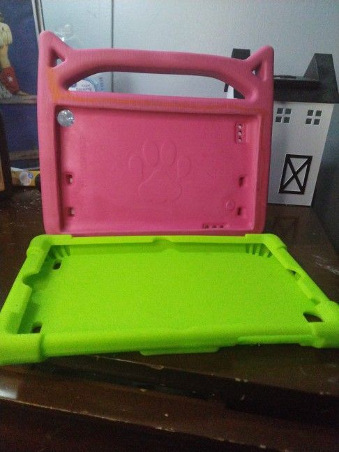 Two Small Tablets No Name One Is Pink with cat , ears , one is neon green