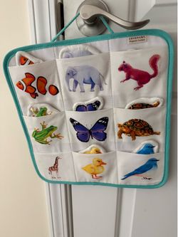 Lovevery animal matching board and Fisher Price hide and peek animal themed toy