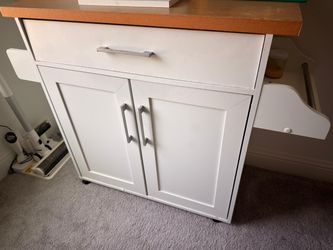 White Kitchen Island with Spice Rack and Towel Holder