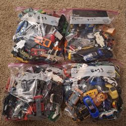 4 Bags Of Assorted 1/64th Cars