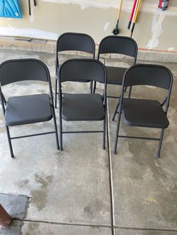 5 metal black chairs