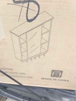 Farmhouse medicine cabinet brand new in the box only white available Brown is just to show the model only white available
