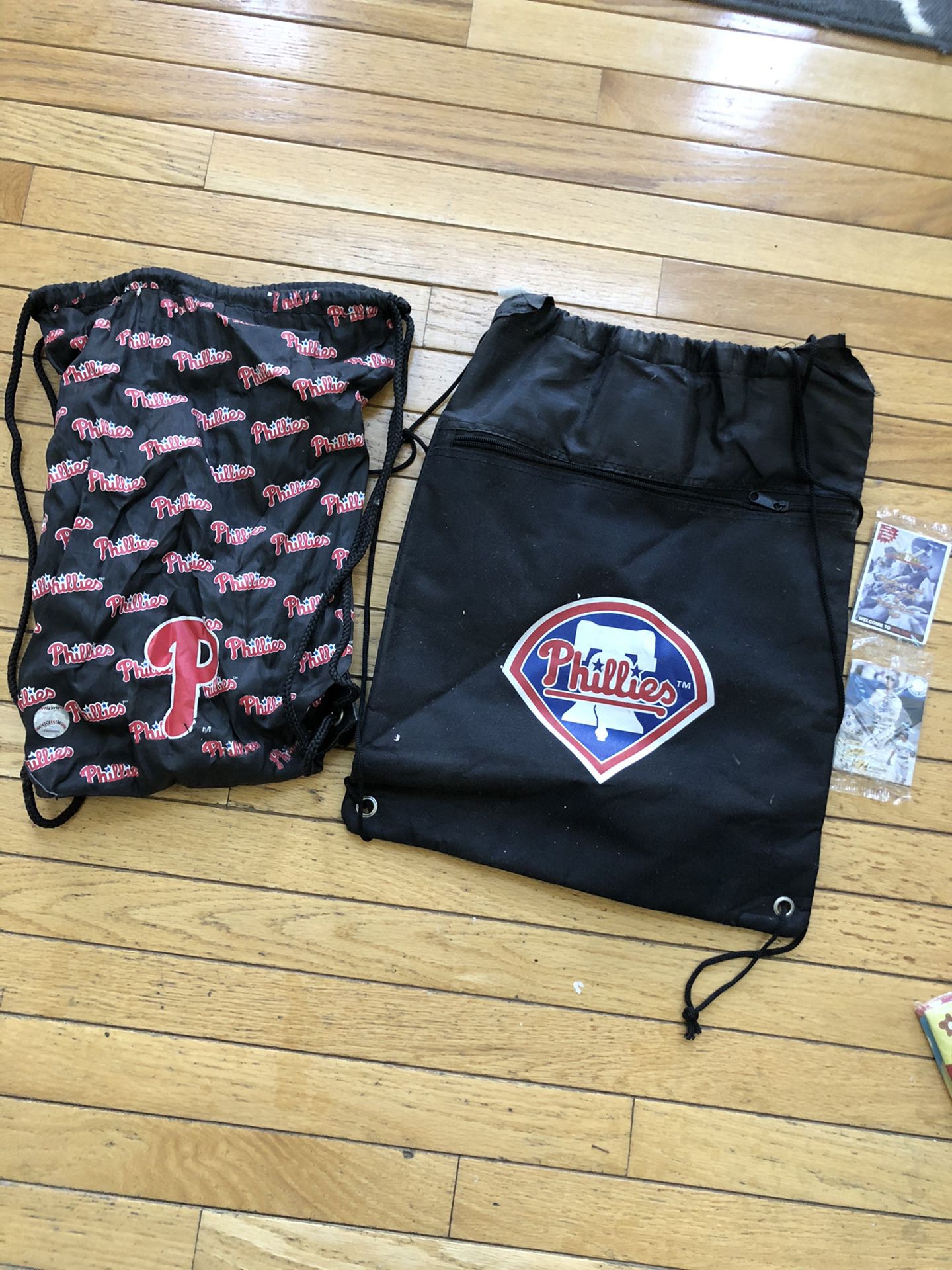 Two Phillies backpacks and baseball cards