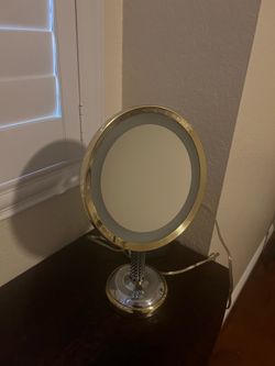Shaving or makeup mirror with light .