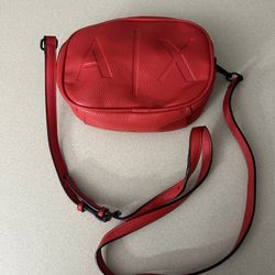 Armani Exchange crossbody bag in red faux leather. 