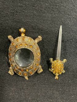 Bombay Co brass two of three-piece desk set. Magnifying glass and letter opener.