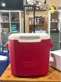 Coleman cooler with wheels and handle.