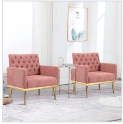 2 pink tufted sitting chairs