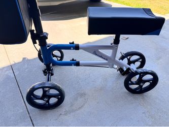 KNEE Scooter.  Plush Seat pad, left /ride side Brake Handles. 300lb. Weight Limit. New.