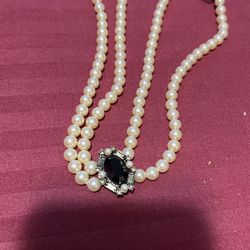 Fresh  Water Pearls With Onyx Surrounding Stones 