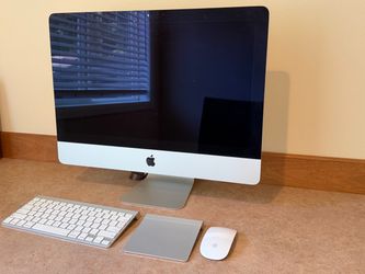 iMac 13,1 and its accessories (wireless & wired keyboards, Magic Trackpad, Magic Mouse)