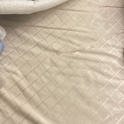a crib mattress with a waterproof mattress cover and three cotton fitted sheets