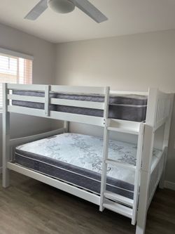 Full over Full bunk bed. Dark walnut,grey & white-$499. Full mattresses -$125.00 each. Assembly not included. Taxes included. Free delivery.  Se habla