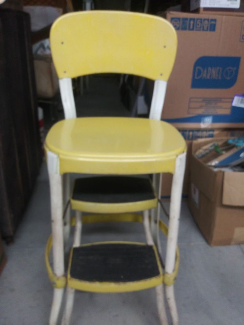 Vintage yellow cosco step stool.