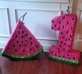 One in melon piñatas