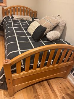 Oak twin bed with headboard and footboard