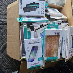 Box Full Of New Cell Phone Cases , Tablets And Screen Protectors
