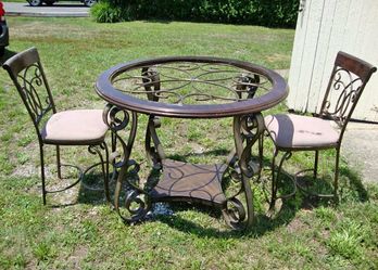 Beautiful real wood table 2 chairs you can stain the wood. I bought Fabric so you can change the cushion delivery fee curbside drop off.