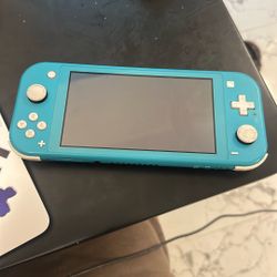 Nintendo Switch Lite With 2 Games 