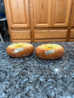 Vintage Ceramic Split Baked Potato Butter Pair of Salt  and Pepper Shakers.  Size appropriately 3 inches long.  Preowned.  Made by Virginia Ann Cerami