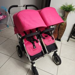 Pink Double Stroller With Child Seat In Back