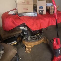 table and 3 chairs and entertainment center