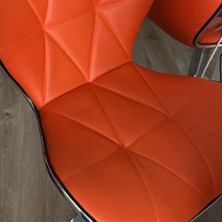 modern orange faux leather adjustable height swivel bar stool with a chrome pedestal base