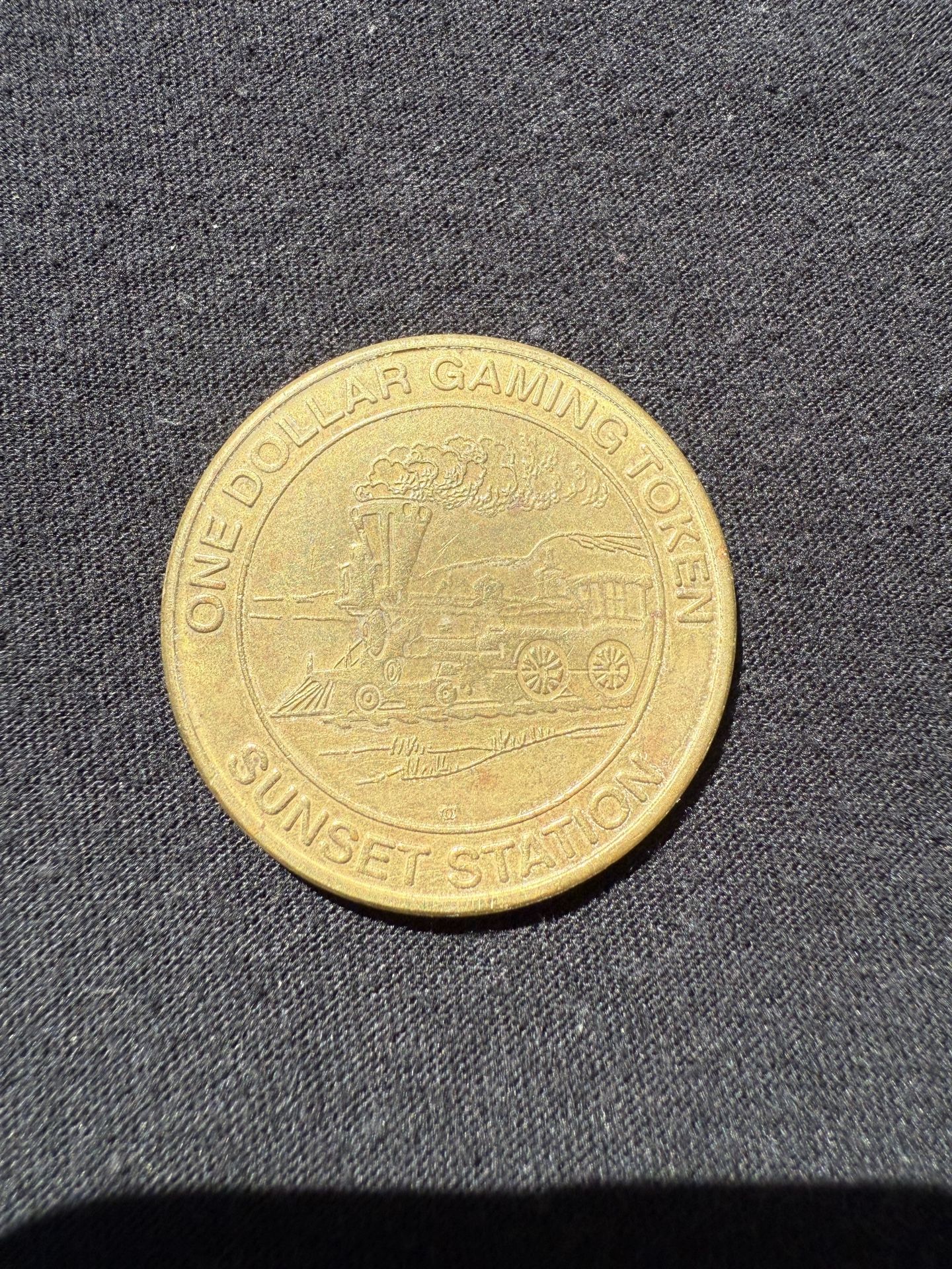 Sunset station one dollar gaming token, 1997