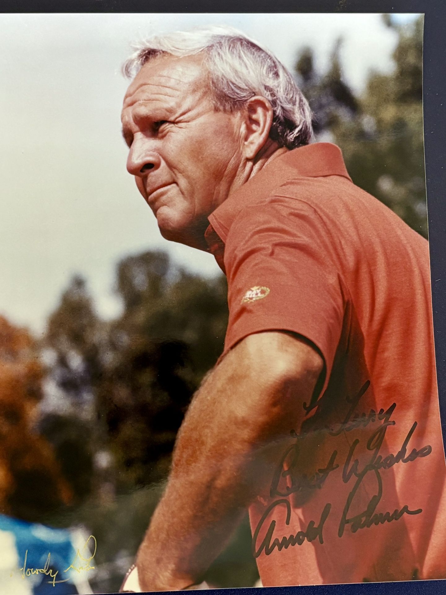Set of two authentic autographed color photographs featuring sports legends Arnold Palmer and Johnny Rutherford, each personally signed and presented