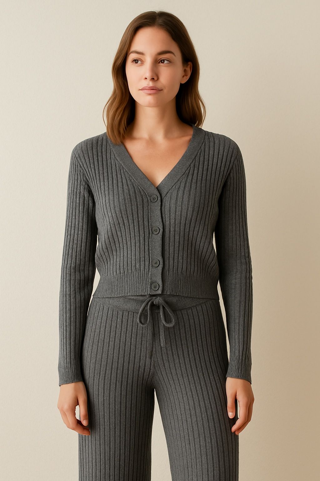 Wrap yourself in cozy elegance with our Charcoal Grey Ribbed Knit Set! Featuring a soft button-front cardigan and matching wide-leg pants