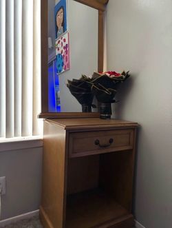 Wooden nightstand with mirror