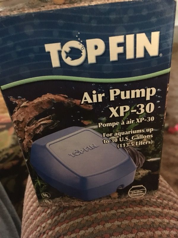 Brand new top fin air pump Xp 30. Also a container of charcoal