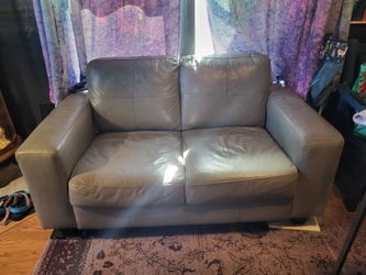 Gray leather loveseat