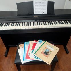 Roland RP 500-CB 88 key digital piano, bench and music books