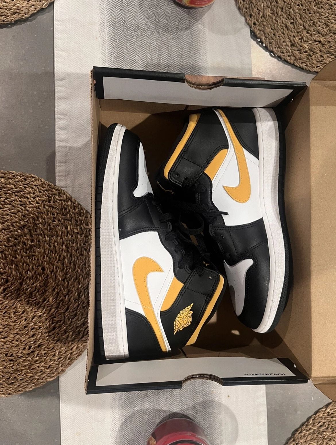 jordan’s 1 mid white pollen black 